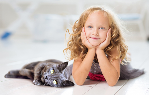 Little girl with cute cats